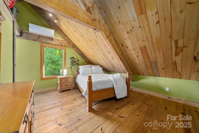 55 Maynards Way, Hendersonville, NC 28792 - bedroom with a wall mounted AC, lofted ceiling, light wood finished floors, and baseboards