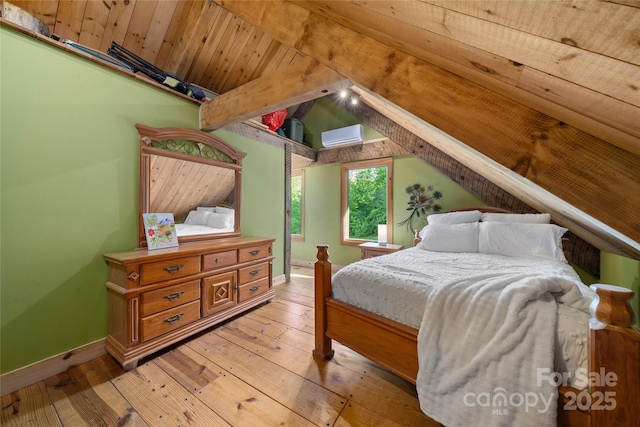 55 Maynards Way, Hendersonville, NC 28792 - bedroom featuring hardwood / wood-style floors, a wall mounted air conditioner, and baseboards