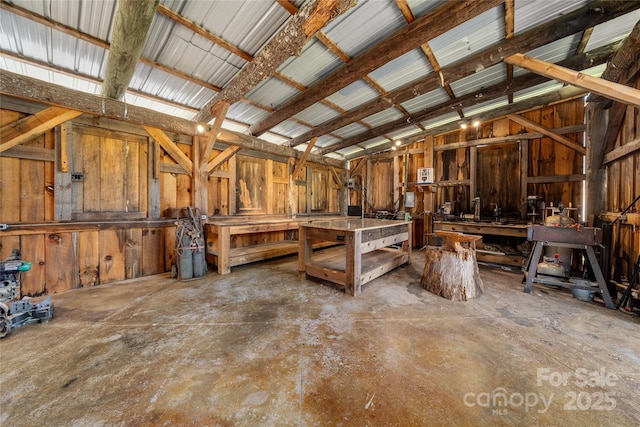 55 Maynards Way, Hendersonville, NC 28792 - miscellaneous room featuring a workshop area, unfinished concrete flooring, and lofted ceiling