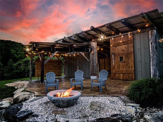 55 Maynards Way, Hendersonville, NC 28792 - patio terrace at dusk with an outdoor fire pit