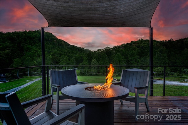 55 Maynards Way, Hendersonville, NC 28792 - deck featuring an outdoor fire pit, a wooded view, and a yard