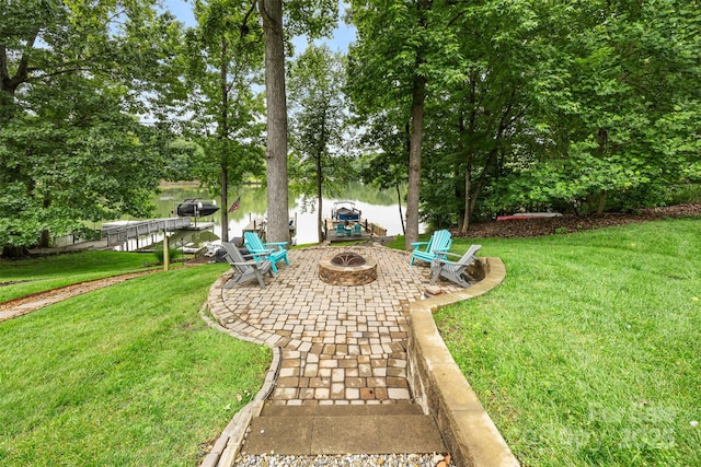 10452 Quiet Bay Ct, Charlotte, NC 28278 - view of green lawn with an outdoor fire pit, a patio area, a water view, and view of wooded area