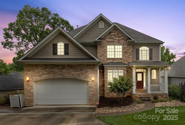 10452 Quiet Bay Ct, Charlotte, NC 28278 - view of front of house with stone siding, concrete driveway, a garage, and roof with shingles
