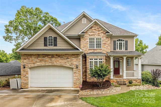 10452 Quiet Bay Ct, Charlotte, NC 28278 - view of front facade featuring stone siding, driveway, roof with shingles, and a garage