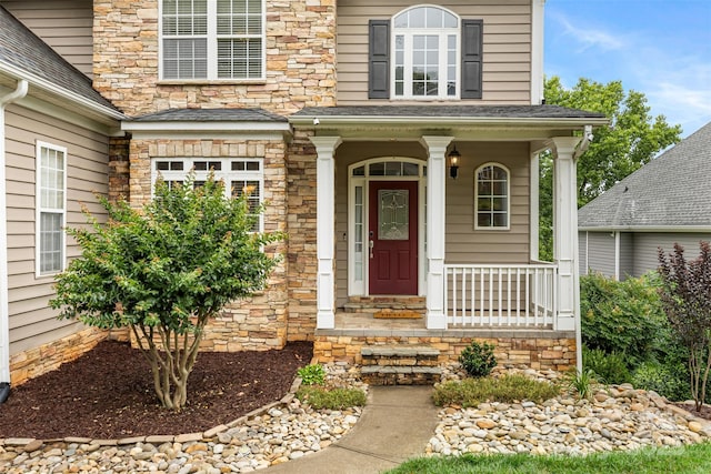 10452 Quiet Bay Ct, Charlotte, NC 28278 - entrance to property with stone siding and a porch