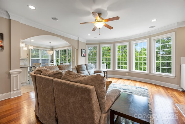 10452 Quiet Bay Ct, Charlotte, NC 28278 - living room featuring arched walkways, ceiling fan, light wood-style flooring, baseboards, and recessed lighting
