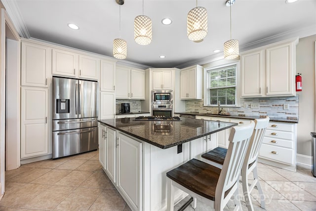 10452 Quiet Bay Ct, Charlotte, NC 28278 - kitchen with appliances with stainless steel finishes, backsplash, crown molding, a kitchen island, and recessed lighting