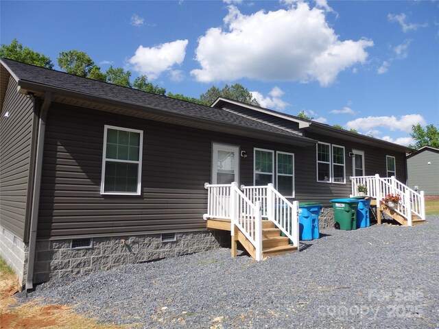 view of front of home featuring crawl space