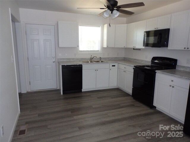 kitchen with black appliances, a sink, ceiling fan, and white cabinetry