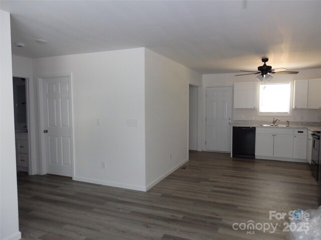 kitchen featuring dishwasher, a sink, a ceiling fan, white cabinetry, and dark wood-type flooring