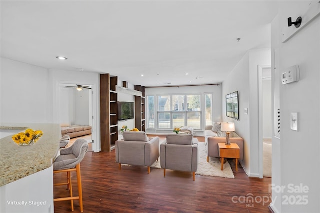 living room featuring dark wood finished floors, recessed lighting, a ceiling fan, and baseboards
