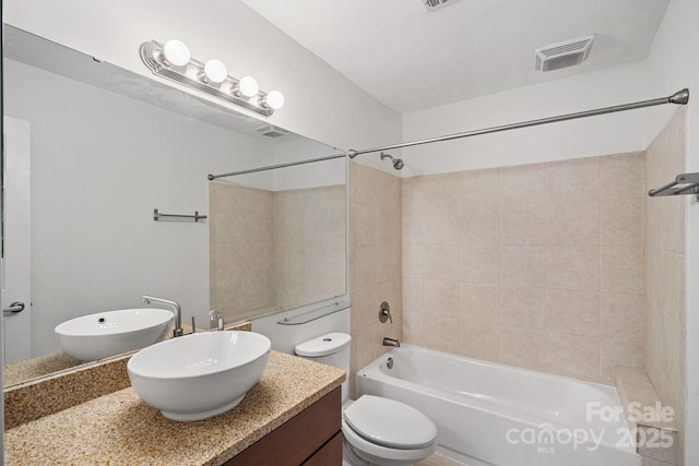 513 N Graham St Unit 1B, Charlotte, NC 28202 - bathroom with bathtub / shower combination, vanity, and toilet