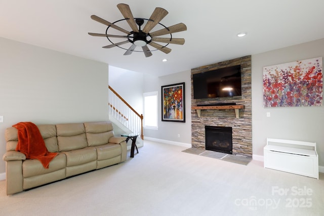 carpeted living room with stairs, recessed lighting, a fireplace, ceiling fan, and baseboards