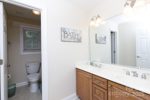 full bath featuring a sink, tile patterned flooring, double vanity, and baseboards