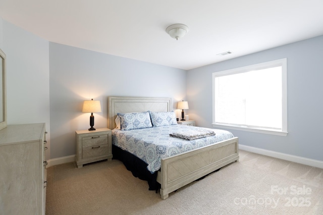 bedroom featuring light carpet, baseboards, and visible vents