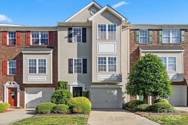 245 Rock Ridge Ln, Mount Holly, NC 28120 - view of property with driveway, a garage, and brick siding