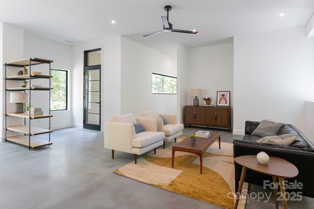 129 English Dr, Candler, NC 28715 - living area featuring finished concrete flooring, baseboards, and recessed lighting