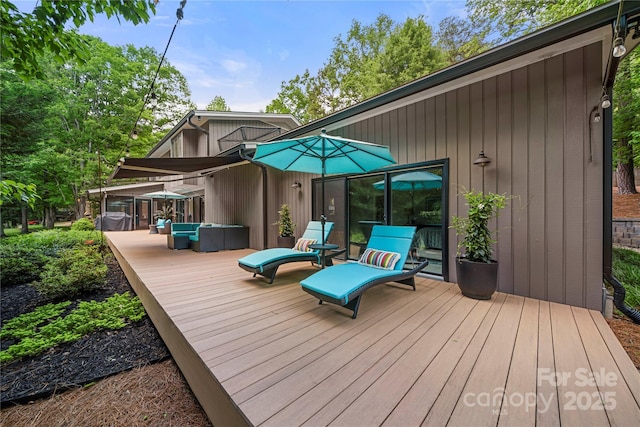 wooden deck with an outdoor hangout area