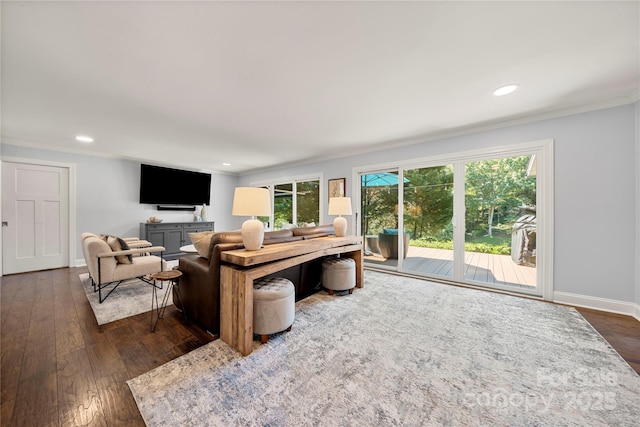living room featuring ornamental molding, dark wood-style floors, recessed lighting, and baseboards