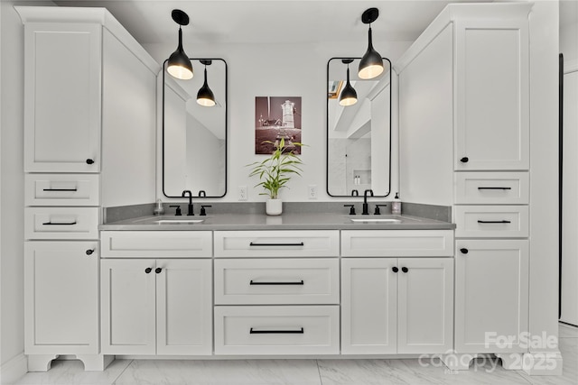 full bath with marble look tiles and double vanity