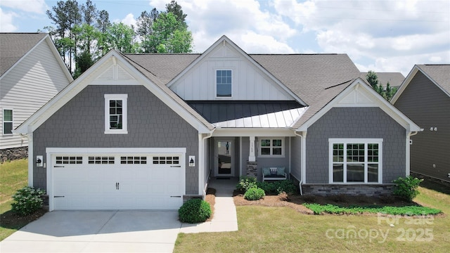 1360 Dali Blvd, Mount Holly, NC 28120 - view of front of property with stone siding, covered porch, driveway, a garage, and a front lawn