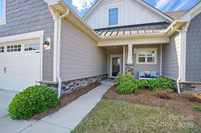 1360 Dali Blvd, Mount Holly, NC 28120 - doorway to property with a standing seam roof, stone siding, metal roof, and covered porch