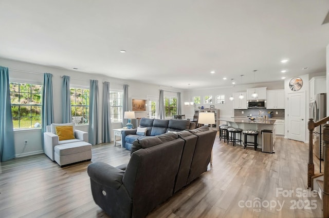 1360 Dali Blvd, Mount Holly, NC 28120 - living room with light wood finished floors, recessed lighting, and baseboards