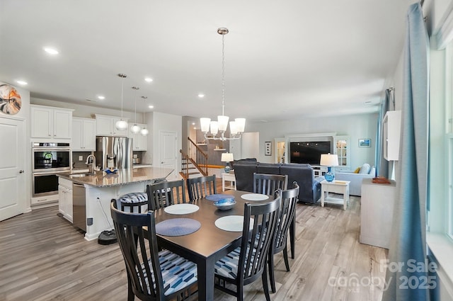 1360 Dali Blvd, Mount Holly, NC 28120 - dining area with light wood-type flooring, a chandelier, and recessed lighting