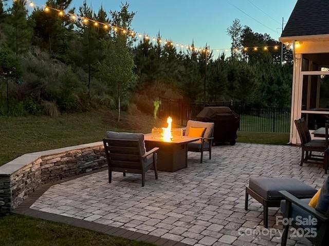 1360 Dali Blvd, Mount Holly, NC 28120 - view of patio featuring an outdoor fire pit