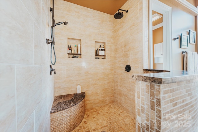 full bathroom with tiled shower