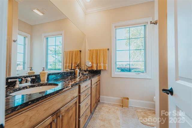 full bathroom featuring crown molding, double vanity, baseboards, toilet, and tile patterned floors