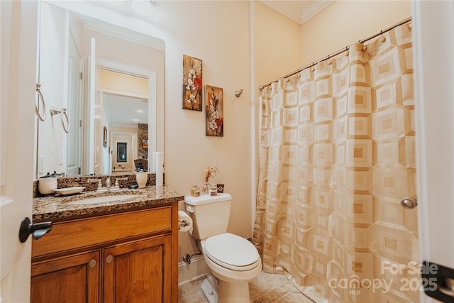 bathroom with ornamental molding, toilet, vanity, tile patterned floors, and a shower with shower curtain