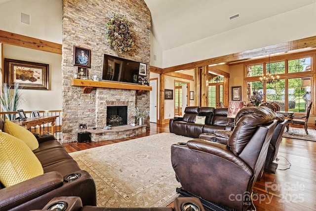 6205 Plantation Pointe Dr, Granite Falls, NC 28630 - living area with high vaulted ceiling, a chandelier, hardwood / wood-style floors, and a fireplace