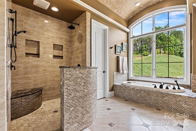 6205 Plantation Pointe Dr, Granite Falls, NC 28630 - full bathroom with a tile shower, tile patterned floors, a garden tub, baseboards, and lofted ceiling