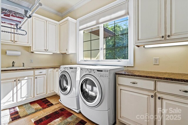 6205 Plantation Pointe Dr, Granite Falls, NC 28630 - washroom featuring cabinet space, washing machine and dryer, crown molding, and light tile patterned flooring