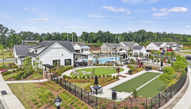 view of community featuring fence