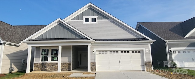 320 Basil Dr, Indian Trail, NC 28079 - craftsman inspired home with board and batten siding, stone siding, concrete driveway, and an attached garage