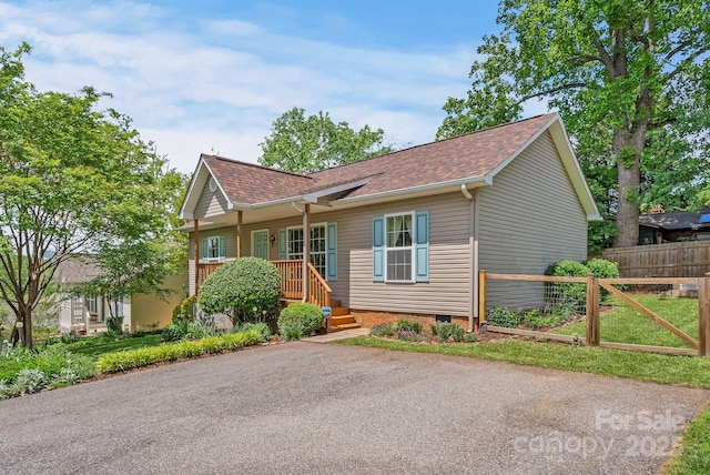 11 Louisville Pl, Asheville, NC 28806 - ranch-style home featuring a shingled roof, fence, and crawl space