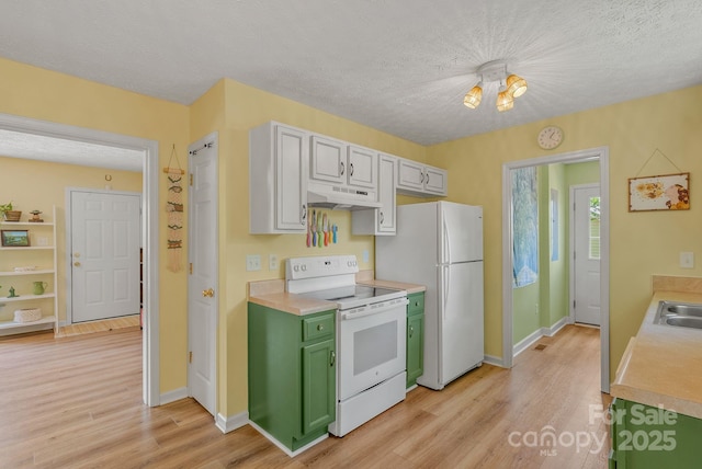 11 Louisville Pl, Asheville, NC 28806 - kitchen featuring white appliances, green cabinets, under cabinet range hood, light countertops, and light wood-style flooring