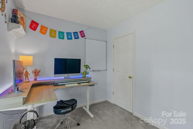 11 Louisville Pl, Asheville, NC 28806 - carpeted home office featuring built in desk, baseboards, and a textured ceiling