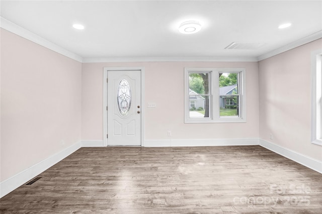 225 N Lee St, Mount Holly, NC 28120 - entrance foyer featuring ornamental molding, wood finished floors, baseboards, and recessed lighting