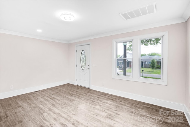 225 N Lee St, Mount Holly, NC 28120 - foyer with wood finished floors, crown molding, and baseboards