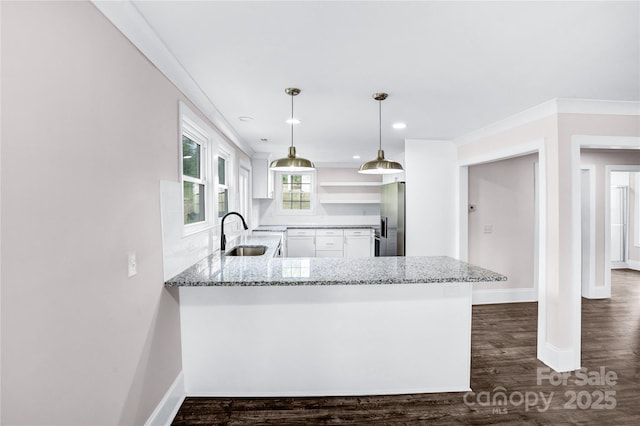 225 N Lee St, Mount Holly, NC 28120 - kitchen with a sink, stainless steel fridge with ice dispenser, light stone countertops, white cabinetry, and a peninsula