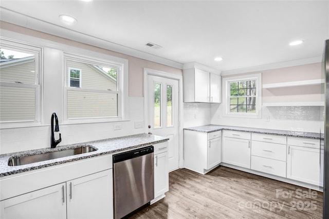 225 N Lee St, Mount Holly, NC 28120 - kitchen with dishwasher, open shelves, a sink, white cabinets, and decorative backsplash