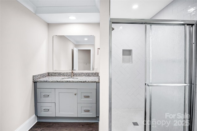 225 N Lee St, Mount Holly, NC 28120 - full bath with wood finished floors, vanity, a stall shower, recessed lighting, and baseboards