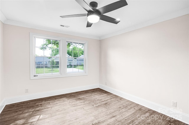225 N Lee St, Mount Holly, NC 28120 - unfurnished room with wood finished floors, baseboards, ornamental molding, and a ceiling fan