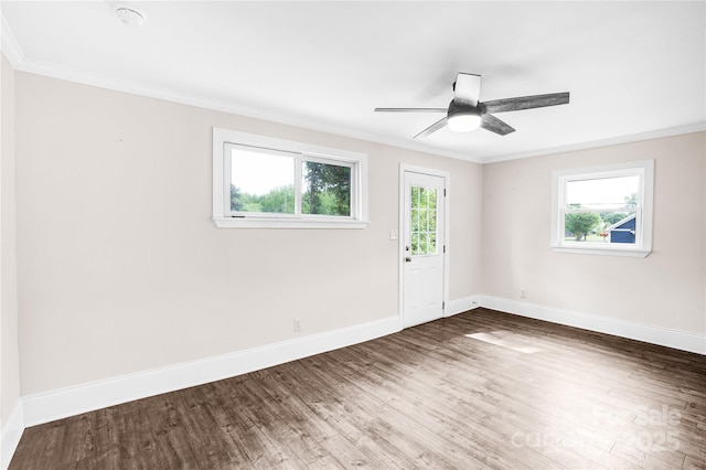 225 N Lee St, Mount Holly, NC 28120 - empty room with ornamental molding, plenty of natural light, baseboards, dark wood-type flooring, and ceiling fan