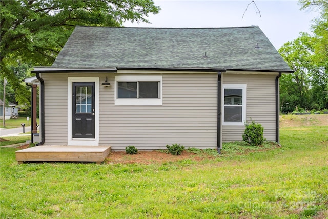 225 N Lee St, Mount Holly, NC 28120 - back of house featuring a lawn and a shingled roof