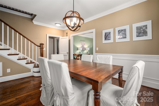 dining area featuring a chandelier, crown molding, stairway, and dark wood finished floors
