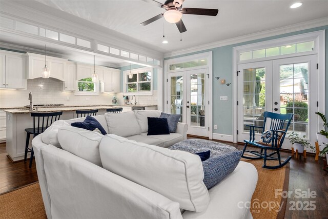 living room with french doors, dark wood-type flooring, crown molding, a ceiling fan, and recessed lighting